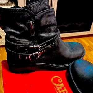 Girl black boot by Carlos by Carlos Santana